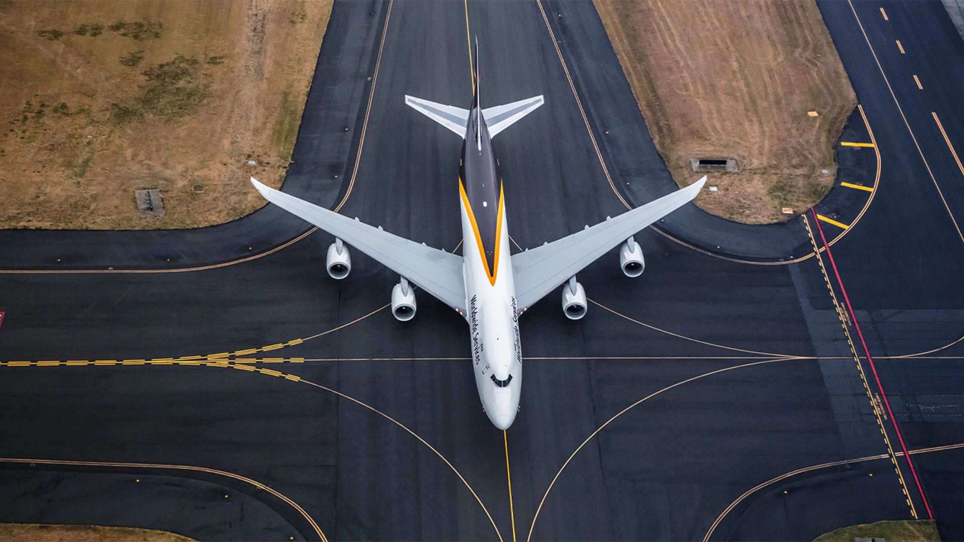 Cargo aircraft in flight symbolizing Marken’s application of precision logistics to solve the global aviation parts supply chain and AOG crisis